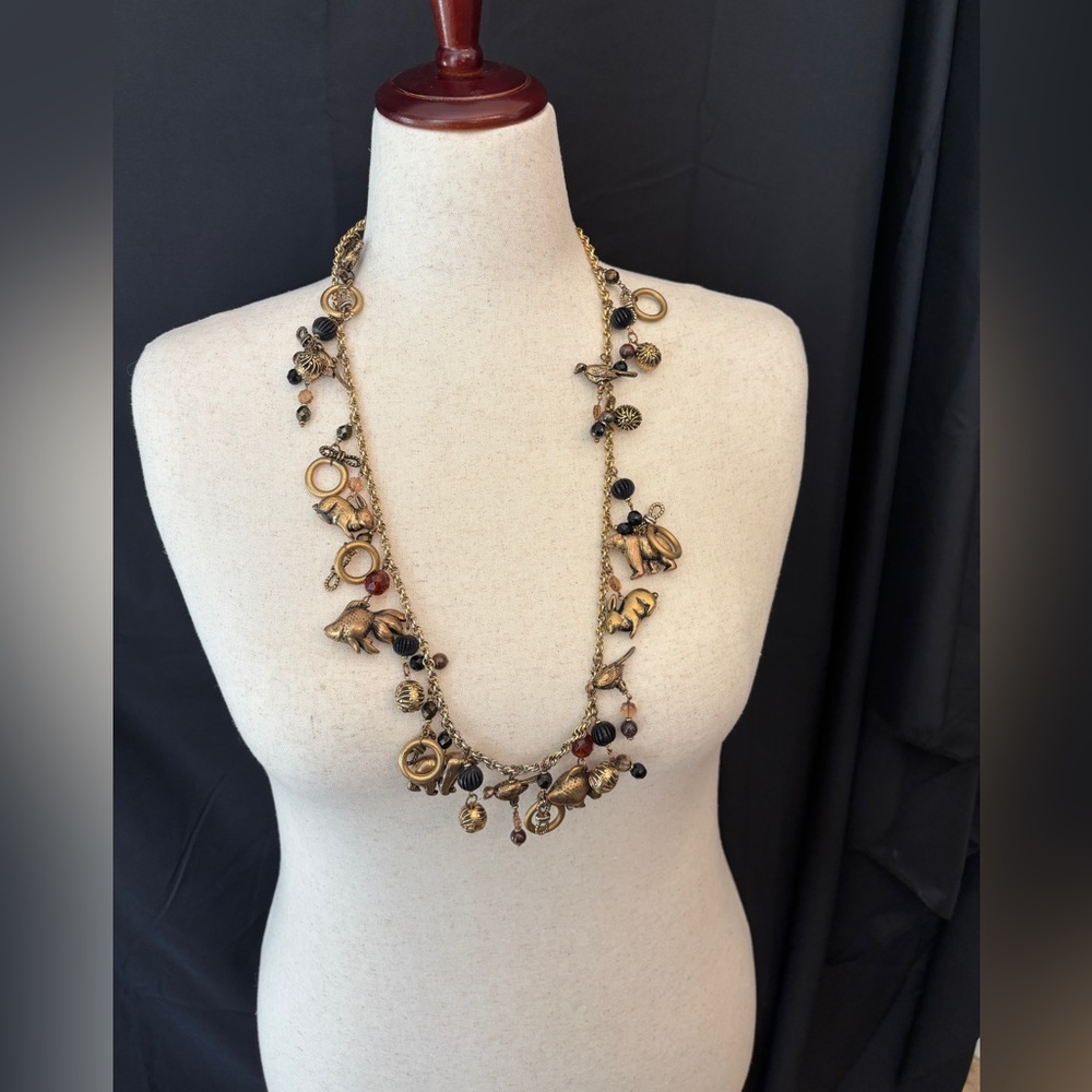 Vintage Roxanne Gold and Black Charm Long Necklace Runway Necklace Bears Fish - Picture 1 of 6
